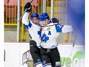 Grant Cruikshank, left, and teammate Owen Sillinger of the Penticton Vees celebrate a goal last year. Cruikshank will start the new BCHL season on the injury list.