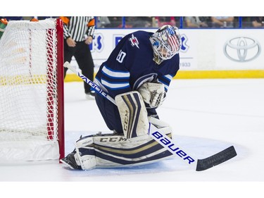 Winnipeg Jets goalie Mikhail Berdin makes a save against the Vancouver Canucks