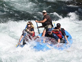 A group of rafters brave the Clackamas River.