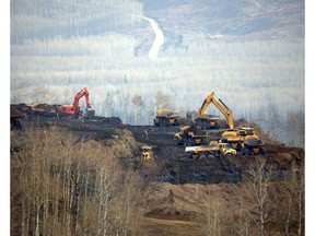 Machines continue to work around Peace River, as part of the Site C dam construction project.
