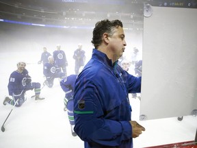 Vancouver Canucks head coach Travis Green explains a drill during the team’s practice at Mercedes-Benz Arena in Shanghai, China, on Sept. 19, 2017. The Canucks and Los Angeles Kings are in China to play two pre-season games.