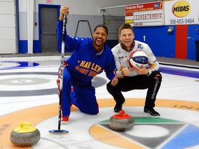 Harlem Globetrotter 'Handles' Franklin celebrates with his instructor Kirk Muyres after making a hit-and-roll into the house at CN Curling Club in Saskatoon on Friday, September 22, 2017. Franklin was in Saskatoon promoting the upcoming Globetrotters' event at SaskTel Centre on Oct. 1 and took some time to take curling lessons from professional curler Muyres.
