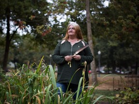 Valerie Nicholson holds an eagle's feather in Vancouver earlier this month. She says her life was saved by the Positive Women's Network.