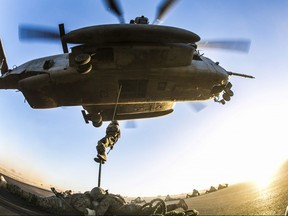 U.S. Marines attending the Infantry Officer Course conduct fast-rope training near Yuma, Ariz., on March 26, 2015.