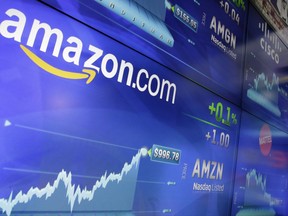 FILE - In this Tuesday, May 30, 2017, file photo, the Amazon logo is displayed at the Nasdaq MarketSite, in New York's Times Square. Amazon announced Thursday, Sept. 7, that it has opened the search for a second headquarters, promising to spend more than $5 billion on the opening.