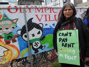 Aboriginal Rose Henry, who says she is homeless, protests outside the Olympic Tent Village in the Downtown Eastside in Vancouver on Feb. 15, 2010, against the Winter Games.