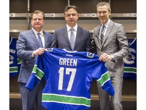 Left to right: Canucks GM Jim Benning, new head coach Travis Green and president of hockey operations, Trevor Linden at Rogers Arena in Vancouver Canucks in Vancouver, B.C., April 26, 2017.