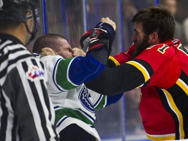 Calgary Flames Hunter Smith (right) lands a punch on the nose of Vancouver Canucks Yan-Pavel Laplante while fighting during NHL preseason hockey action at the Young Stars Classic held at the South Okanagan Events Centre in Penticton, BC, September, 10, 2017. (Richard Lam/PNG) (For ) 00050536A [PNG Merlin Archive]
RICHARD LAM, PNG