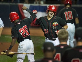 Vancouver Canadians' Brock Lundquist celebrates his home run against the Eugene Emeralds in Game 3 of the Northwest League championship series at Nat Bailey Stadium on Monday.