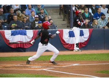 Centre fielder Reggie Pruitt - #13 -  gets a hit during game 4 against the Eugene Emeralds.