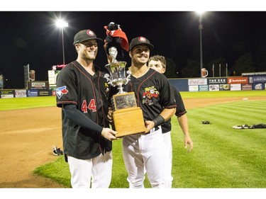 Vancouver Canadians celebrate after their championship win against the Eugene Emeralds.