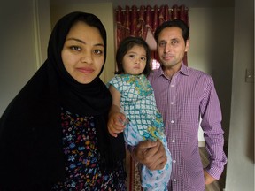 Mohammad and Fireshta Sardar with 18-month-old daughter Nilaa at their home in Burnaby. The Sardars are refugees from Afghanistan, where the Taliban put out a contract on Mohamad's life because he was a translator for the Canadian military.