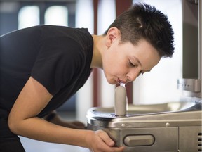 Westin, a Grade 7 student at Chief Dan George Middle School in Abbotsford, drinks from one of the school's new fountains. Abbotsford school district replaced fixtures and piping as a permanent fix after testing showed elevated lead levels in 36 schools. Such replacement is considered the best measure to reduce lead levels.