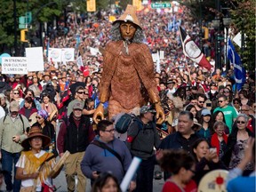 Meh'k, a giant Coast Salish puppet, towers above the crowd as thousands of people participate in the Walk for Reconciliation in Vancouve on Sunday September. The two kilometre walk was held to promote positive relations between Indigenous and non-Indigenous people in Canada.