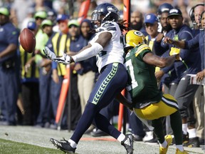 Seattle Seahawks' Shaquill Griffin breaks up a pass intended for Green Bay Packers' Davante Adams during the first half of their NFL game on Sunday, Sept. 10, 2017, in Green Bay, Wis.