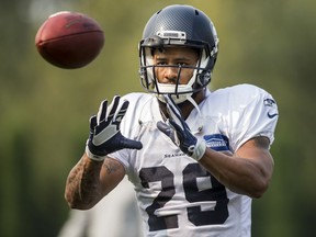 Seattle Seahawks free safety Earl Thomas does some throwing and catching with his fellow defensive players at the Seattle Seahawks training camp in Renton, Wash, in August 2017.