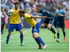 Jordan Harvey of the Vancouver Whitecaps, right, knows the Colorado Rapids are capable of playing superb soccer. The Caps host the Rapids on Saturday in MLS action at B.C. Place Stadium.