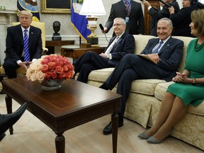 President Donald Trump pauses during a meeting with, from left, Senate Majority Leader Mitch McConnell, R-Ky., Senate Minority Leader Chuck Schumer, D-N.Y., House Minority Leader Nancy Pelosi, D-Calif., and other Congressional leaders in the Oval Office of the White House, Wednesday, Sept. 6, 2017, in Washington. Trump overruled congressional Republicans and his own treasury secretary Wednesday and cut a deal with Democrats to fund the government and raise the federal borrowing limit for three months, all part of an agreement to speed money to Harvey relief.