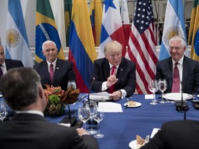 White House Chief of Staff John Kelly (L), Colombia's President Juan Manuel Santos (2L), US Vice President Mike Pence (3L), US Secretary of State Rex Tillerson (2R) and Panama's President Juan Carlos Varela (R) listen while US President Donald Trump speaks before a dinner with Latin American and US leaders at the Palace Hotel during the 72nd session of the United Nations General Assembly September 18, 2017 in New York City.
