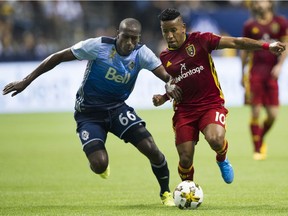 Vancouver's Aly Ghazal and Real Salt Lake's Joao Plata chase down the ball during Saturday MLS game at B.C. Place, which the Whitecaps won 3-2.