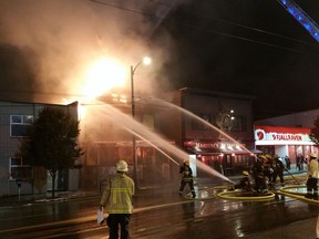 Vancouver fire fighters battle a blaze on Sunday night at 163 West Broadway, the African Arts and Drums building.