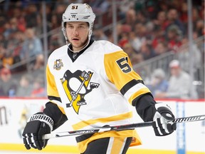 The Vancouver Canucks have acquired defenceman Derrick Pouliot (right) from the Pittsburgh Penguins, giving up rearguard Andrey Pedan.