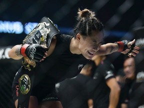 Angela Lee celebrates after defeating Istela Nunes of Brazil in the women's atom weight world championship bout during the One Championship Dynasty of Heroes at the Singapore Indoor Stadium on May 26, 2017 in Singapore.