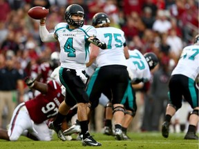 Alex Ross (4) of the Coastal Carolina Chanticleers drops back to pass against the South Carolina Gamecocks at Williams-Brice Stadium on Nov. 23, 2013, in Columbia, S.C.