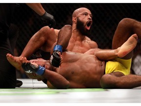 Demetrious Johnson celebrates as he defeats Wilson Reis to win their Flyweight Championship bout on UFC Fight Night at the Sprint Center on April 15, 2017 in Kansas City, Missouri.