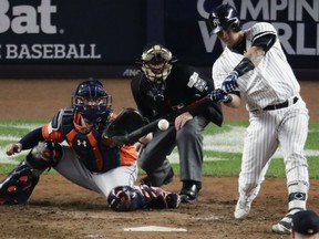 Gary Sanchez of the Yankees hits a home run during the seventh inning of Game 5 of the American League Championship Series against the Houston Astros on Wednesday night in New York.