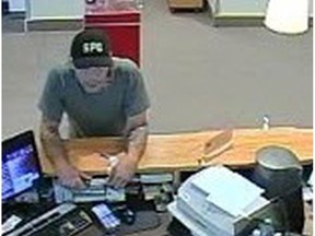 ABBOTSFORD, B.C.: OCT. 15, 2017 – Abbotsford Police are seeking a suspect in relation to a bank robbery on October 15, 2017 around 12:25 p.m. The suspect is described as a Caucasian male, 30-40 years of age, 5'10" tall, with a medium build. He was wearing a green shirt, light-coloured jeans and a baseball cap with the letters "SPC" on it. [PNG Merlin Archive] HANDOUT, PNG