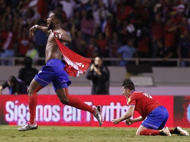 Costa Rica's Kendall Waston, left, celebrates after scoring his team's equalizer against Honduras during a World Cup qualifying soccer match at the National Stadium in San Jose, Costa Rica.