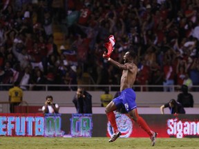 Costa Rica's Kendall Waston celebrates after scoring his team's equalizer against Honduras during a World Cup qualifying soccer match at the National Stadium in San Jose.