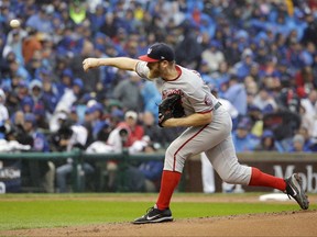 Washington Nationals starting pitcher Stephen Strasburg throws during the first inning of Game 4 of baseball's National League Division Series against the Chicago Cubs, Oct. 11, 2017, in Chicago.