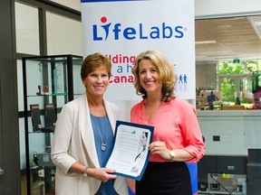 Sue Paish, CEO of LifeLabs, signs Minerva B.C.’s Face of Leadership pledge to support women’s advancement and leadership.
