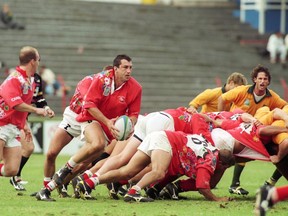 Al Charron of Canada picks up the ball from the base of the scrum during a 1995 Rugby World Cup match against Australia in Port Elizabeth, South Africa.
