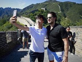One of the newest Vancouver Canucks, Michael Del Zotto, has taken over the role of DJ in the team's dressing room. Del Zotto is shown here during team's recent trip to the Great Wall of China.