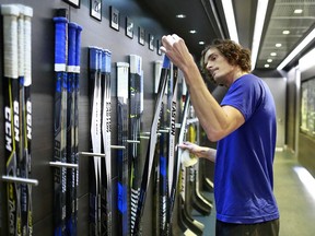 Loui Eriksson of the Vancouver Canucks checks his game sticks before their NHL game against the Winnipeg Jets at Rogers Arena on October 12, 2017.