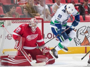 Sam Gagner jumps out of the way of a shot in front of goaltender Jimmy Howard.