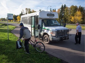 Joe Scheck, 60, of Houston moves his bike after a bus driver removed it from the front of a B.C. Transit bus upon arrival in Smithers on Sept. 27, 2017. The new transit service on the Highway of Tears began in June connecting Burns Lake and Houston with Smithers on Mondays, Wednesdays and Fridays. Another new route connecting Burns Lake and Prince George runs Tuesdays, Thursdays and Saturdays.