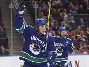 Vancouver Canucks' Jake Virtanen (18) celebrates a goal on Edmonton Oilers' goalie Laurent Brossoit during first period pre-season NHL action in Edmonton, Alta., on Friday September 22, 2017. Brock Boeser spent some nervous days in his hotel room, wondering if he had done enough in training camp and pre-season to stick with the Vancouver Canucks. Virtanen only realized he made the team after seeing the hockey bag of the player he was battling for a spot packed and ready to be shipped off to the minors.