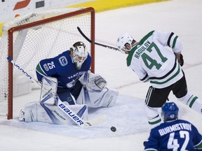 Jacob Markstrom, Alexander Radulov

Dallas Stars' Alexander Radulov, right, of Russia, fails to get his stick on the puck as it bounces in front of Vancouver Canucks' goalie Jacob Markstrom, of Sweden, during the second period of an NHL hockey game in Vancouver, B.C., on Monday October 30, 2017. THE CANADIAN PRESS/Darryl Dyck ORG XMIT: VCRD219
DARRYL DYCK,