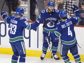 Sam Gagner is congratulated for his 3rd period goal and first as a Canuck.