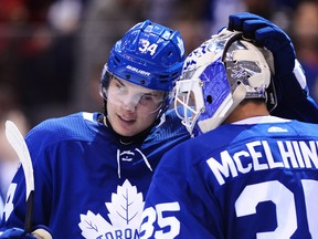 Auston Matthews celebrates with Maple Leafs goaltender Curtis McElhinney after beating the Detroit Red Wings 6-3 at the Air Canada Centre in Toronto on Wednesday night.