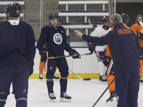 Edmonton Oilers' Leon Draisaitl (29) listens to head coach Todd McLellan (right) during practice with the team at the Downtown Community Arena at Rogers Place ahead of a Oct. 9 game versus the Winnipeg Jets in Edmonton, Alberta on Sunday, October 8, 2017.