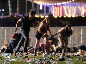 People run from the music festival after gunfire was heard in Las Vegas.