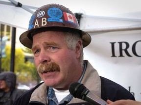 Perley Holmes, then the business manager for Iron Workers Local 97 in Burnaby, talks to reporters at a 2006 union rally in Vancouver’s Library Square.