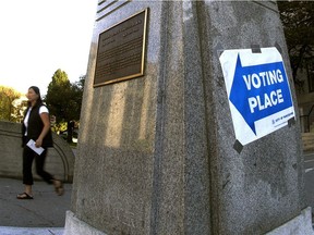 FILE PHOTO - A voter heading to the polling booths at Vancouver City Hall for the 2004 municipal election.