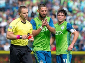 Seattle Sounders midfielder Clint Dempsey makes a mocking clap at the referee after receiving a red card during the first half of an MLS soccer game against the Colorado Rapids in Seattle on Sunday, Oct. 22, 2017.