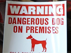 A dangerous dog warning sign.
